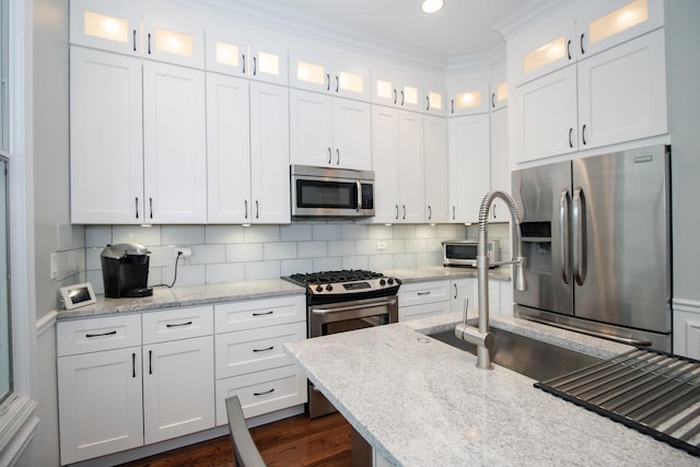 235 S Marion St Unit C, Oak Park, IL 60302 - kitchen with stainless steel appliances, white cabinetry, decorative backsplash, light stone countertops, and recessed lighting