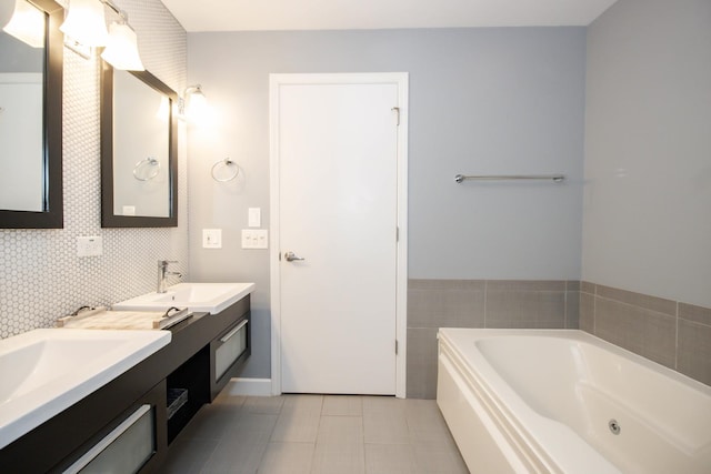 235 S Marion St Unit C, Oak Park, IL 60302 - bathroom featuring two vanities, a tub with jets, and tile patterned floors