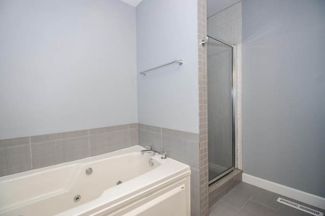 235 S Marion St Unit C, Oak Park, IL 60302 - bathroom with a stall shower, a tub with jets, and tile patterned flooring