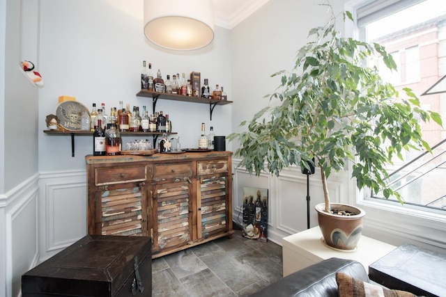 235 S Marion St Unit C, Oak Park, IL 60302 - indoor dry bar with wainscoting, crown molding, stone finish floors, and a decorative wall