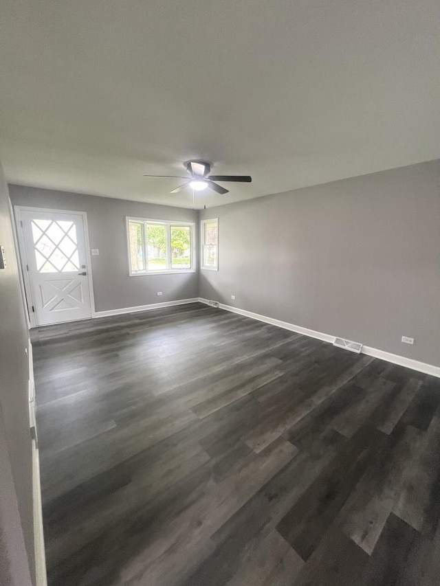 16759 Forest View Dr, Tinley Park, IL 60477 - unfurnished room with baseboards, a ceiling fan, and dark wood-style flooring