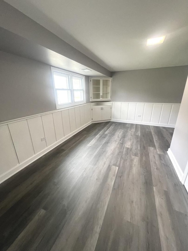 16759 Forest View Dr, Tinley Park, IL 60477 - spare room featuring dark wood-type flooring and wainscoting