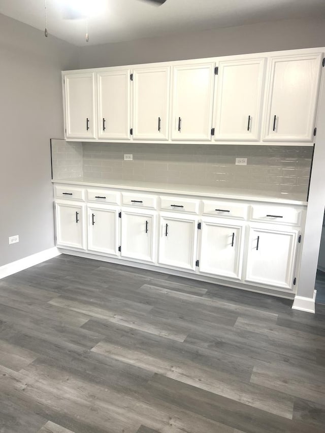 16759 Forest View Dr, Tinley Park, IL 60477 - kitchen with baseboards, white cabinetry, and backsplash