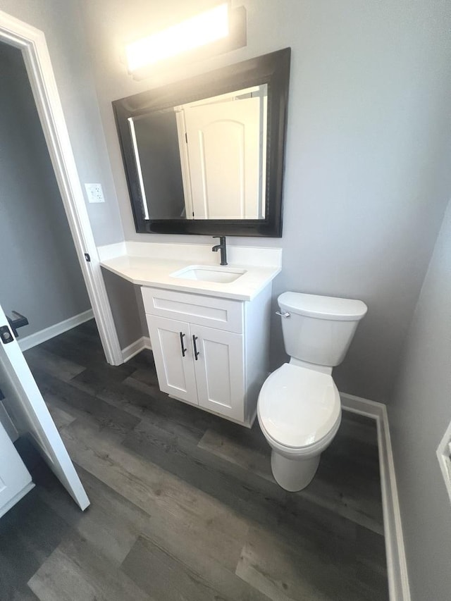 16759 Forest View Dr, Tinley Park, IL 60477 - bathroom with vanity, wood finished floors, toilet, and baseboards