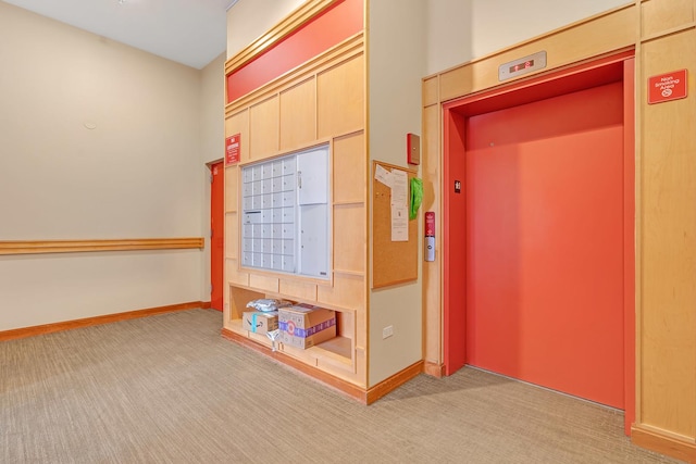 1572 N Maple Ave Unit 401, Evanston, IL 60201 - hallway featuring elevator, mail area, carpet, and baseboards