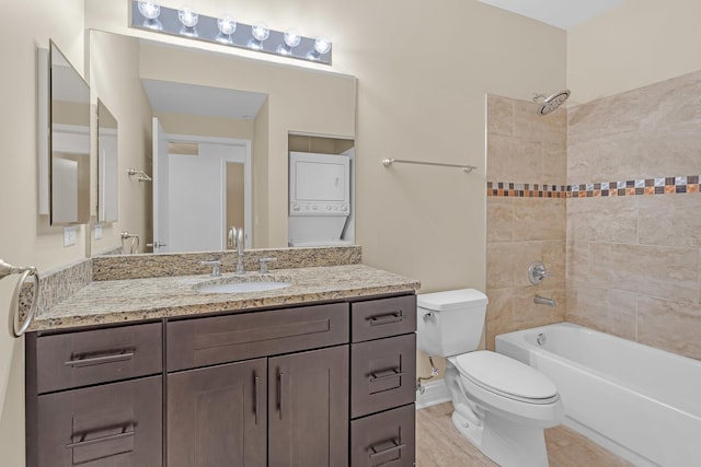 1572 N Maple Ave Unit 401, Evanston, IL 60201 - bathroom with stacked washer / drying machine, toilet, vanity, and washtub / shower combination