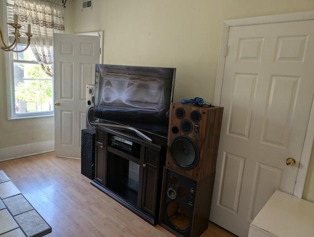 3233 S Morgan St, Chicago, IL 60608 - detailed view of a chandelier, wood finished floors, and baseboards