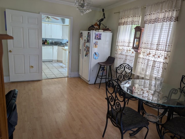 3233 S Morgan St, Chicago, IL 60608 - dining space featuring ornamental molding, a ceiling fan, and light wood-style floors