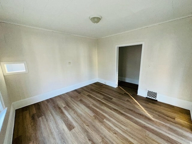 259 N Evergreen Ave, Kankakee, IL 60901 - unfurnished room featuring wood finished floors, ornamental molding, and baseboards