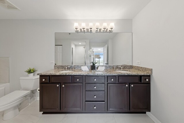 1250 S Indiana Ave Unit 1301, Chicago, IL 60605 - bathroom featuring toilet, double vanity, a shower, baseboards, and marble look tile flooring