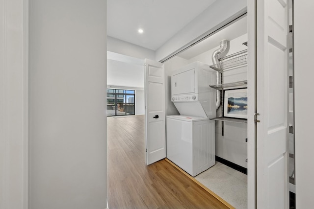 1250 S Indiana Ave Unit 1301, Chicago, IL 60605 - washroom featuring stacked washer / drying machine, light wood-style flooring, and recessed lighting