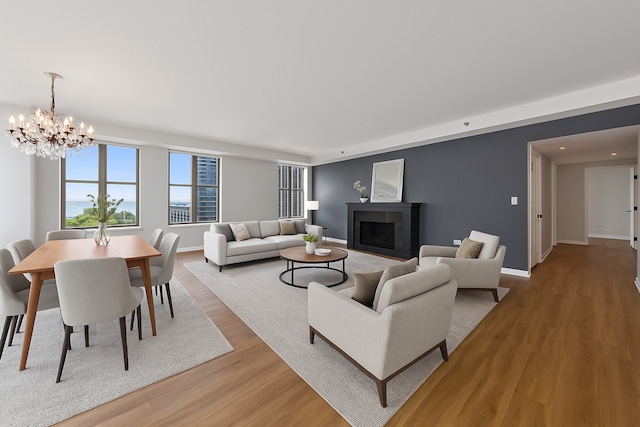 1250 S Indiana Ave Unit 1301, Chicago, IL 60605 - living area with light wood-type flooring, a chandelier, baseboards, a fireplace with flush hearth, and recessed lighting