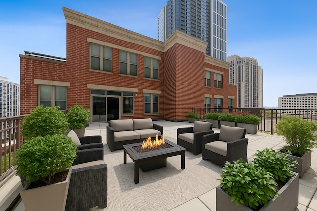 1250 S Indiana Ave Unit 1301, Chicago, IL 60605 - view of patio featuring an outdoor living space with a fire pit