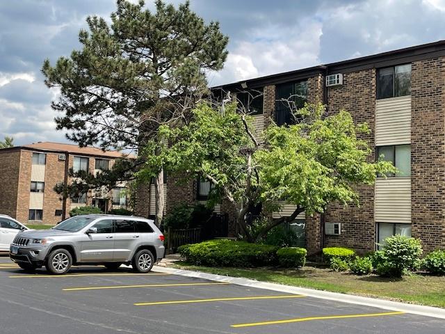 160 Dunteman Dr Unit 201, Glendale Heights, IL 60139 - view of property with uncovered parking