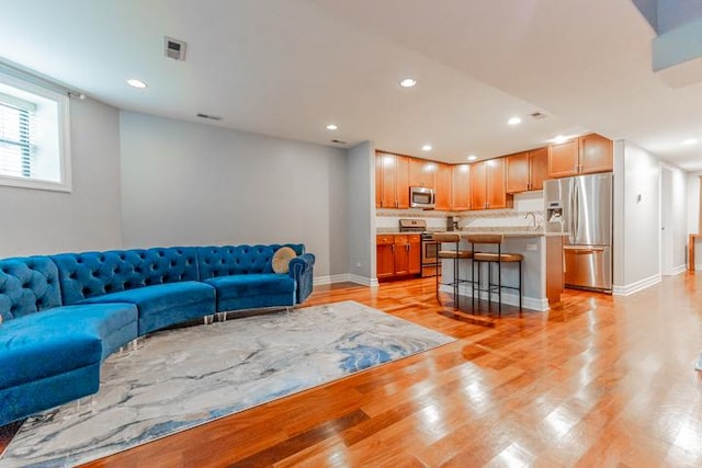 4111 N Kenmore Ave Unit 1Ng, Chicago, IL 60613 - living room with light wood finished floors, baseboards, and recessed lighting
