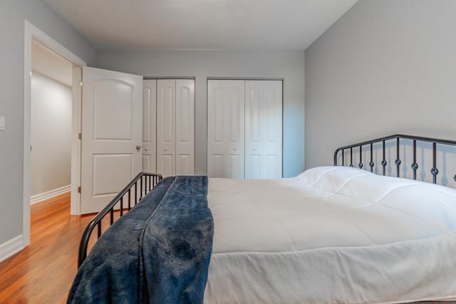 4111 N Kenmore Ave Unit 1Ng, Chicago, IL 60613 - bedroom with two closets, wood finished floors, and baseboards