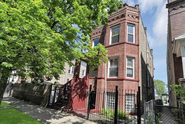4130 W Potomac Ave, Chicago, IL 60651 - view of front of home with brick siding and a fenced front yard
