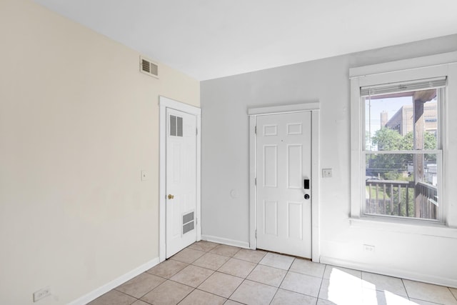 4130 W Potomac Ave, Chicago, IL 60651 - entryway featuring light tile patterned floors and baseboards