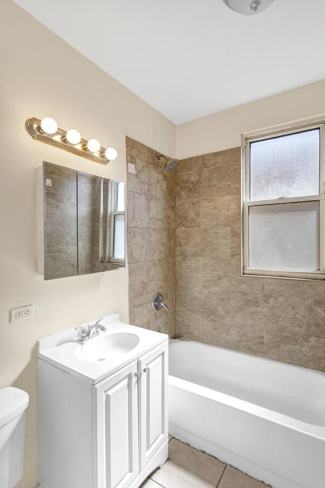 4130 W Potomac Ave, Chicago, IL 60651 - full bathroom with vanity, toilet, tile patterned floors, and shower / bathtub combination