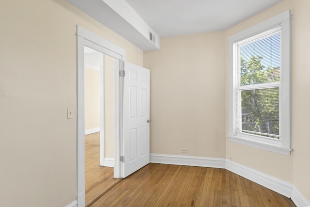 4130 W Potomac Ave, Chicago, IL 60651 - unfurnished room with baseboards, hardwood / wood-style flooring, and plenty of natural light