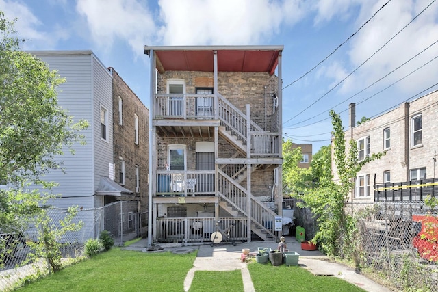4130 W Potomac Ave, Chicago, IL 60651 - back of house featuring brick siding and stairs