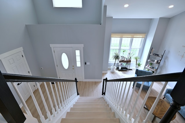 1422 Deer Creek Ln, Lake In The Hills, IL 60156 - stairs with wood finished floors, a high ceiling, recessed lighting, and baseboards