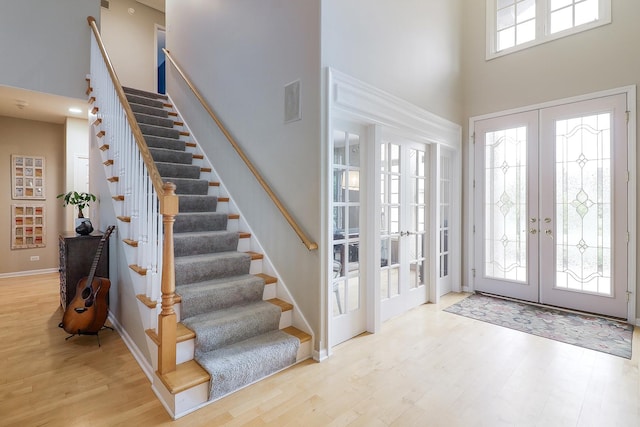 3536 Scottsdale Cir, Naperville, IL 60564 - entryway featuring french doors, a high ceiling, stairs, and wood finished floors
