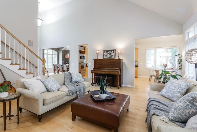 3536 Scottsdale Cir, Naperville, IL 60564 - living area with high vaulted ceiling, light wood finished floors, and stairway