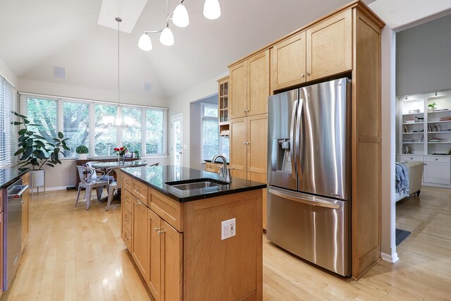 3536 Scottsdale Cir, Naperville, IL 60564 - kitchen featuring appliances with stainless steel finishes, dark stone counters, an island with sink, light wood-style floors, and high vaulted ceiling