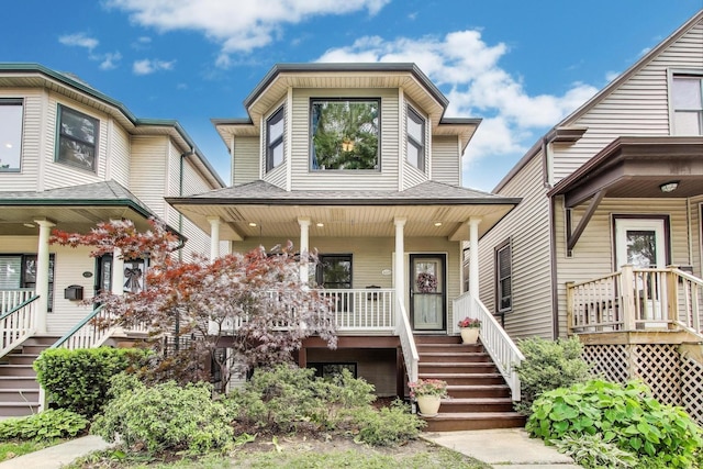 4229 N Albany Ave, Chicago, IL 60618 - view of front of house featuring stairs, a porch, and a shingled roof