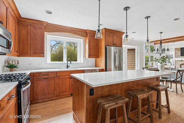 1181 Midwest Ln, Wheaton, IL 60189 - kitchen with appliances with stainless steel finishes, a sink, plenty of natural light, brown cabinets, and recessed lighting