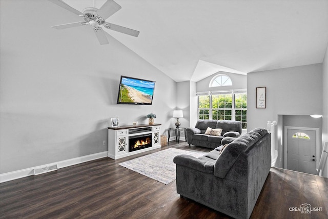 303 Meadows Dr, Sugar Grove, IL 60554 - living room featuring vaulted ceiling, wood finished floors, a ceiling fan, baseboards, and a warm lit fireplace