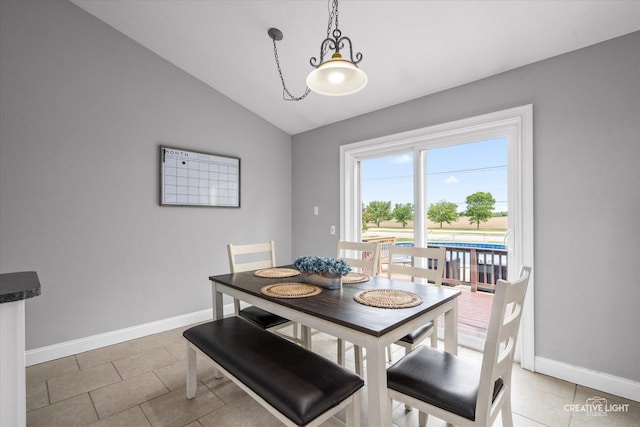 303 Meadows Dr, Sugar Grove, IL 60554 - dining room with vaulted ceiling, baseboards, and light tile patterned floors