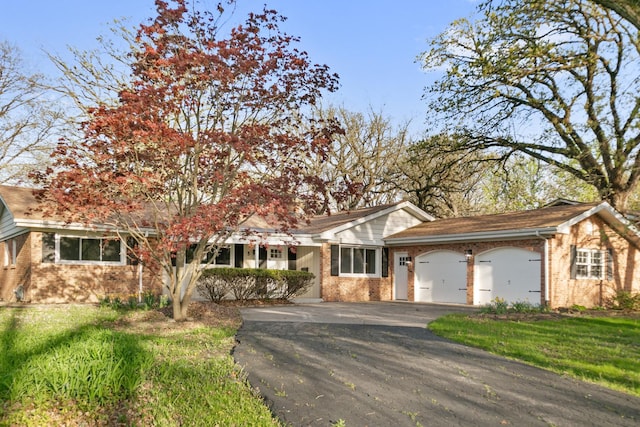 5 Danube Way, Olympia Fields, IL 60461 - view of front facade with brick siding, asphalt driveway, a garage, and a front lawn