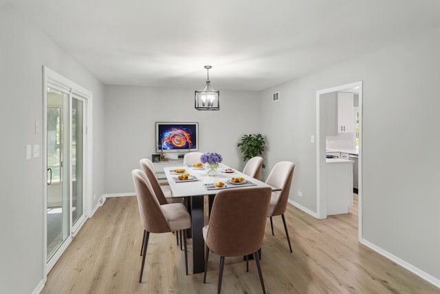 5 Danube Way, Olympia Fields, IL 60461 - dining room featuring light wood-type flooring, a chandelier, and baseboards