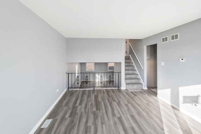 922 E 155th St, Phoenix, IL 60426 - unfurnished living room with wood finished floors, baseboards, and stairs
