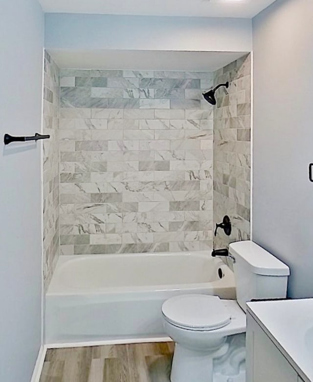 922 E 155th St, Phoenix, IL 60426 - full bath featuring vanity, toilet, bathing tub / shower combination, and wood finished floors