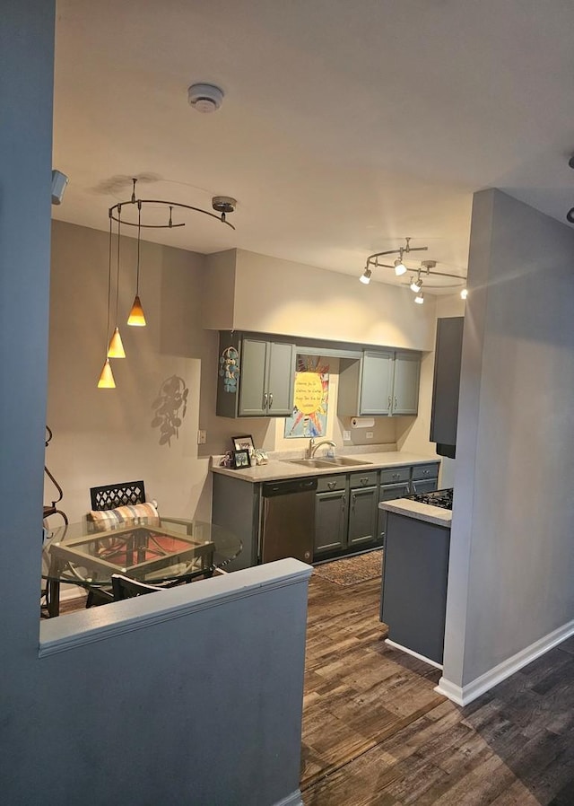 8314 Sierra Woods Ln, Carpentersville, IL 60110 - kitchen featuring stainless steel dishwasher, dark wood-style floors, rail lighting, and decorative light fixtures