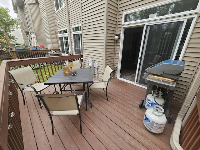 8314 Sierra Woods Ln, Carpentersville, IL 60110 - deck with outdoor dining area and a grill