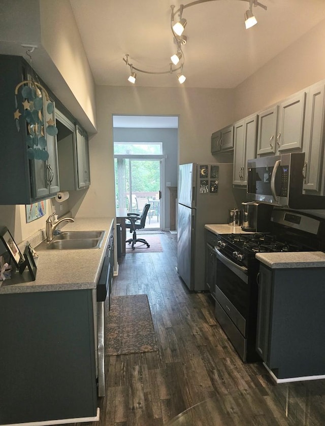 8314 Sierra Woods Ln, Carpentersville, IL 60110 - kitchen with appliances with stainless steel finishes, dark wood-style floors, light countertops, and gray cabinets