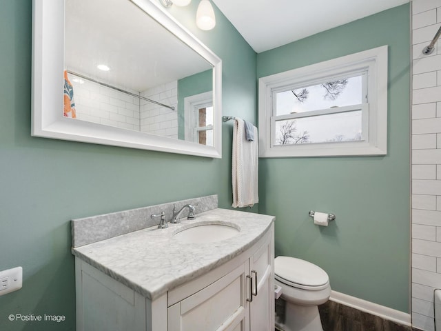 4048 W 105th St, Oak Lawn, IL 60453 - full bath featuring vanity, tiled shower, and wood finished floors