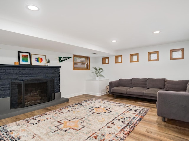 4048 W 105th St, Oak Lawn, IL 60453 - living room featuring wood finished floors, a stone fireplace, and recessed lighting