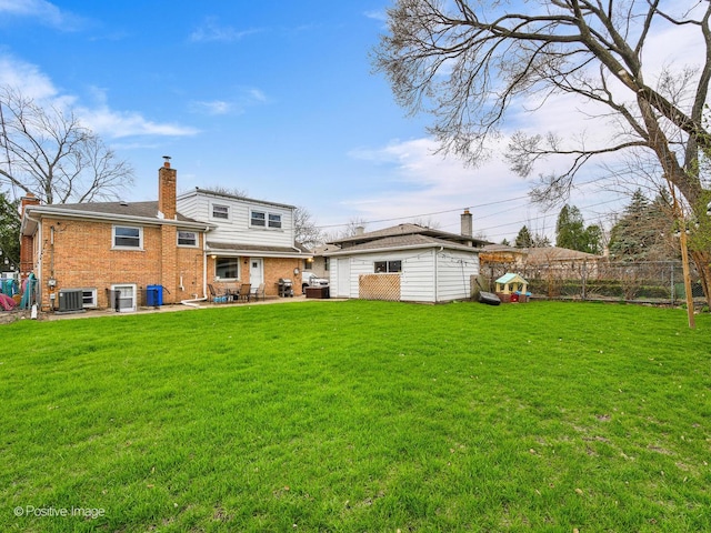 4048 W 105th St, Oak Lawn, IL 60453 - back of house featuring a patio, brick siding, a chimney, and an outdoor structure