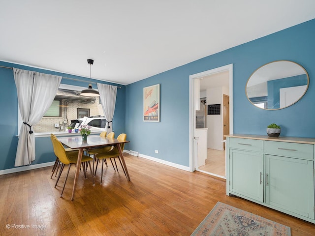 4048 W 105th St, Oak Lawn, IL 60453 - dining space featuring baseboards and light wood-type flooring