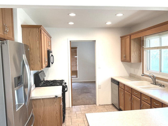 813 Junie Ct, Joliet, IL 60435 - kitchen with appliances with stainless steel finishes, brown cabinets, light countertops, recessed lighting, and light colored carpet