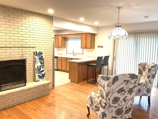 813 Junie Ct, Joliet, IL 60435 - dining area featuring light wood-type flooring, a fireplace, and recessed lighting