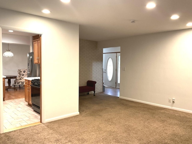 813 Junie Ct, Joliet, IL 60435 - entrance foyer with light carpet, recessed lighting, and a chandelier