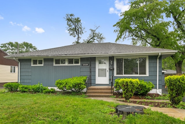 15439 Cherry St, South Holland, IL 60473 - view of front facade with a front yard and roof with shingles