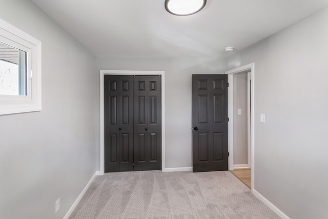 15439 Cherry St, South Holland, IL 60473 - unfurnished bedroom with light colored carpet, baseboards, and a closet