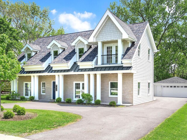 608 W 55th St, Hinsdale, IL 60521 - view of front facade with a balcony, an outdoor structure, a standing seam roof, roof with shingles, and covered porch